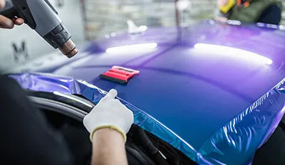 Professional film installer at work